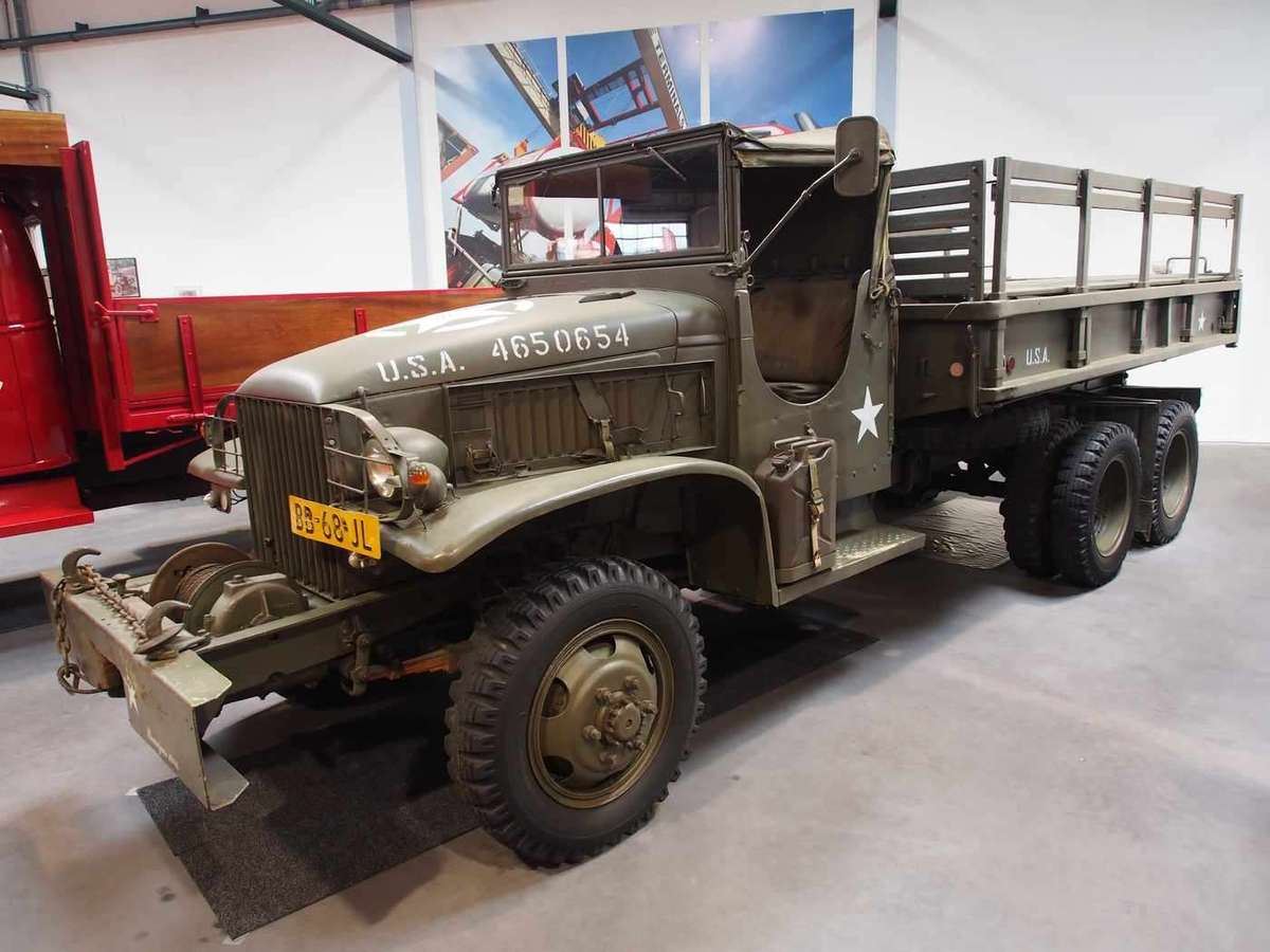 1942 GMC CCKW 2.5-ton military cargo truck, preserved in a European classic vehicle museum.